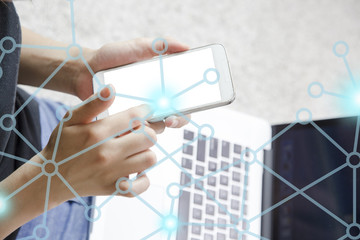 Young woman using smarth phone.  businessman hand working with modern technology and digital layer effect as business strategy concept