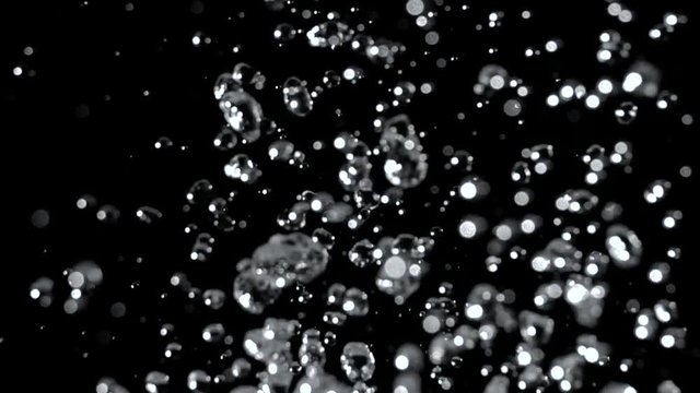 Water splashes a huge splash of rain. Black background. Slow motion