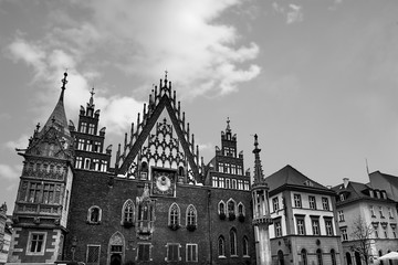 Wroclaw Town Hall at Market Square against bright summer sky. Historical capital of Silesia Poland, Europe. Travel vacation concept. Black and White