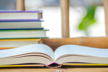 Books stack on the wooden chair for business, education back to school concept.
