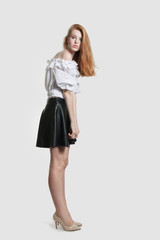 the red-haired girl is turning his head to the side.