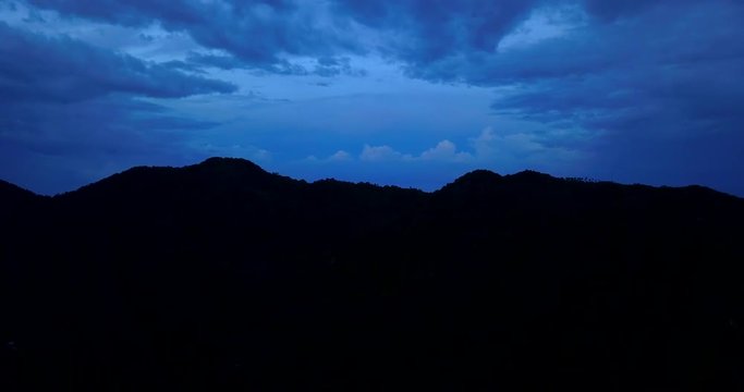 Sunrise over mountain line. Bright blue,dark blue around  mount silhouette line. Colorful nature with black empty space