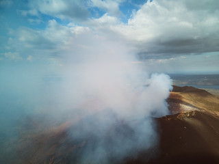 Obraz premium Big smoke coming from volcano crater