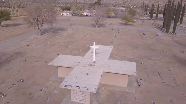 Drone Aerial rotating around Cross Cemetery