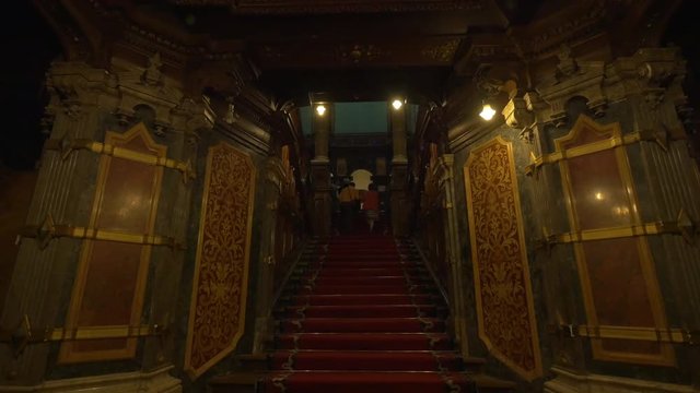 People going up the stairs in Peles Castle