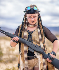 The Queen of the Apocalypse. A female militia soldier in a post-apocalyptic desert wasteland. Urban...