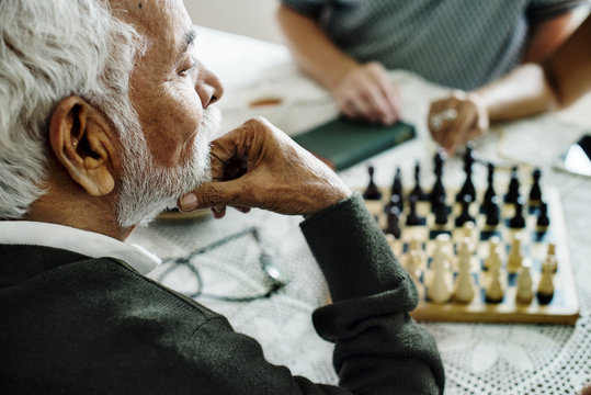 Senior people playing chess