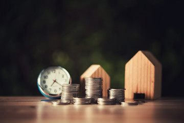 Saving to buy a house or home savings concept with money coin stack growing.Saving money concept.