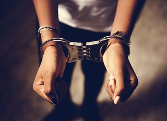 Prisoner with handcuffs on hands