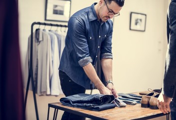 Man working in retail cloth shop