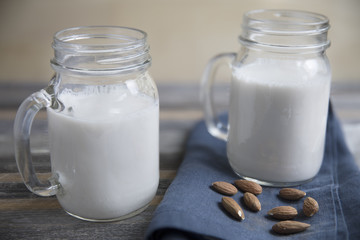 Jars of Almond Milk with Raw Almonds