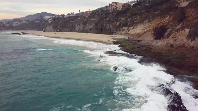 Ocean Beach waves crashing dolly in drone shot