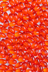 Red shiny pills background