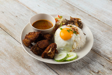 malaysian fried chicken rice with anchovies and egg