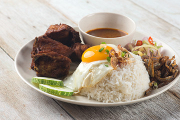 malaysian fried chicken rice with anchovies and egg