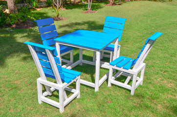 blue chairs on green grass