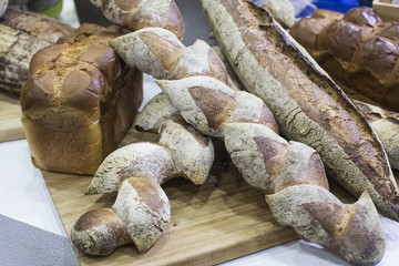 Fresh bread on table close-up. Fresh bread on the kitchen table The healthy eating and traditional bakery