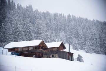 small house in winter at italy