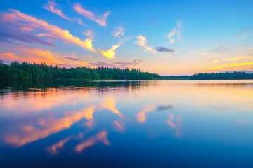 Foto op Canvas Beautiful landscape with colorful sunset over forest lake © sborisov