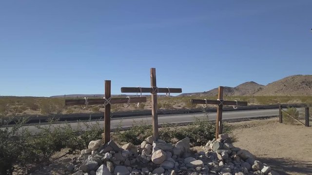 Wooden crosses rotating drone shot in the desert