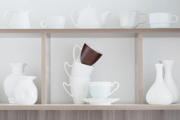 white kitchenware on wooden shelf