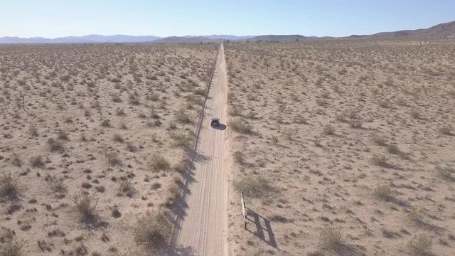 Desert dirt road tracking vehicle