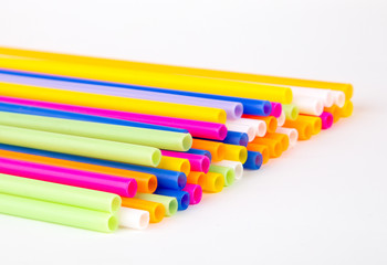 Colorful plastic tubes isolated on a white background. Close up.