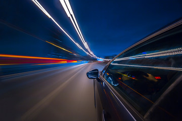 View from Side of Car moving in a night city