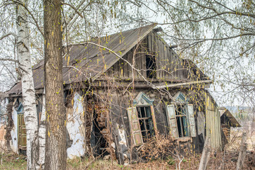 Abandoned destroyed wooden house russian village.