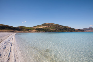 tranquil scene with calm lake and white sand, salda golu, turkey