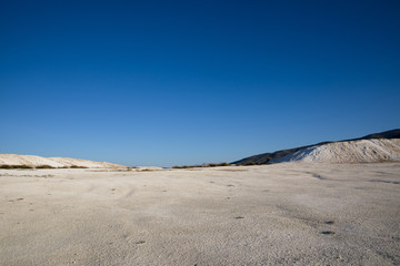 spectacular tranquil landscape with white rocks and limestone at sunny day, salda golu, turkey