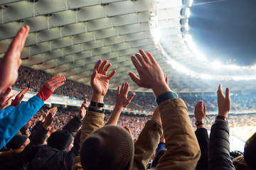 Football- Soccer,a lot of fans in full stadium celebrate there goal in open air roof stadium.