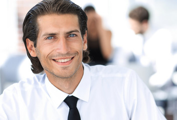 young businessman on background of office