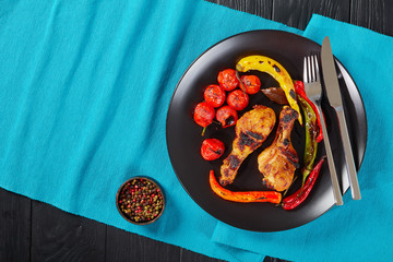 portion of tasty grilled chicken drumsticks
