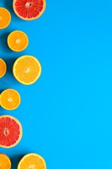 Citrus fruits top view border background.