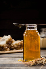 Linden honey in a transparent glass bottle