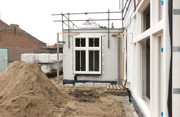 Building site with house under construction