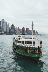 Ferry in Hong Kong with the city in the background