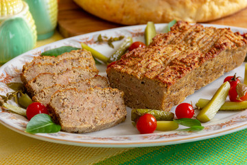 meat bread with side dish of pickled vegetables