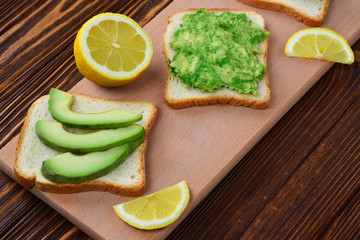 Avocado sandwich on a bread made with fresh sliced avocados from above