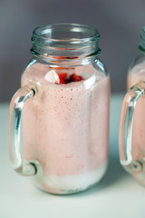 Strawberry milkshake in the glass jar