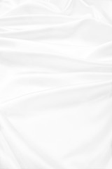 Naklejka premium Smooth elegant white silk or satin luxury cloth texture as wedding background. Luxurious background design
