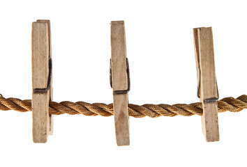 wooden clothespins on a rope isolated on white background