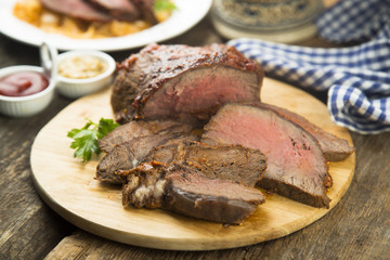Homemade roastbeef on wooden board