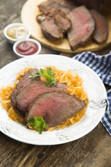 Beef fillet serves with sauerkraut