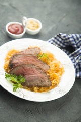 Beef fillet serves with sauerkraut