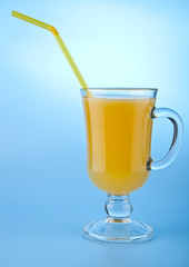 orange juice on a blue background
