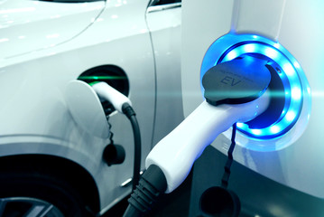 Power supply connect to electric vehicle for charge to the battery. Charging technology industry...