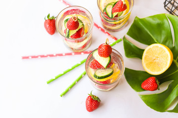 Traditional Pimms cocktail with lemonade, strawberries, cucumber, orange and mint