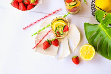 Traditional Pimms cocktail with lemonade, strawberries, cucumber, orange and mint